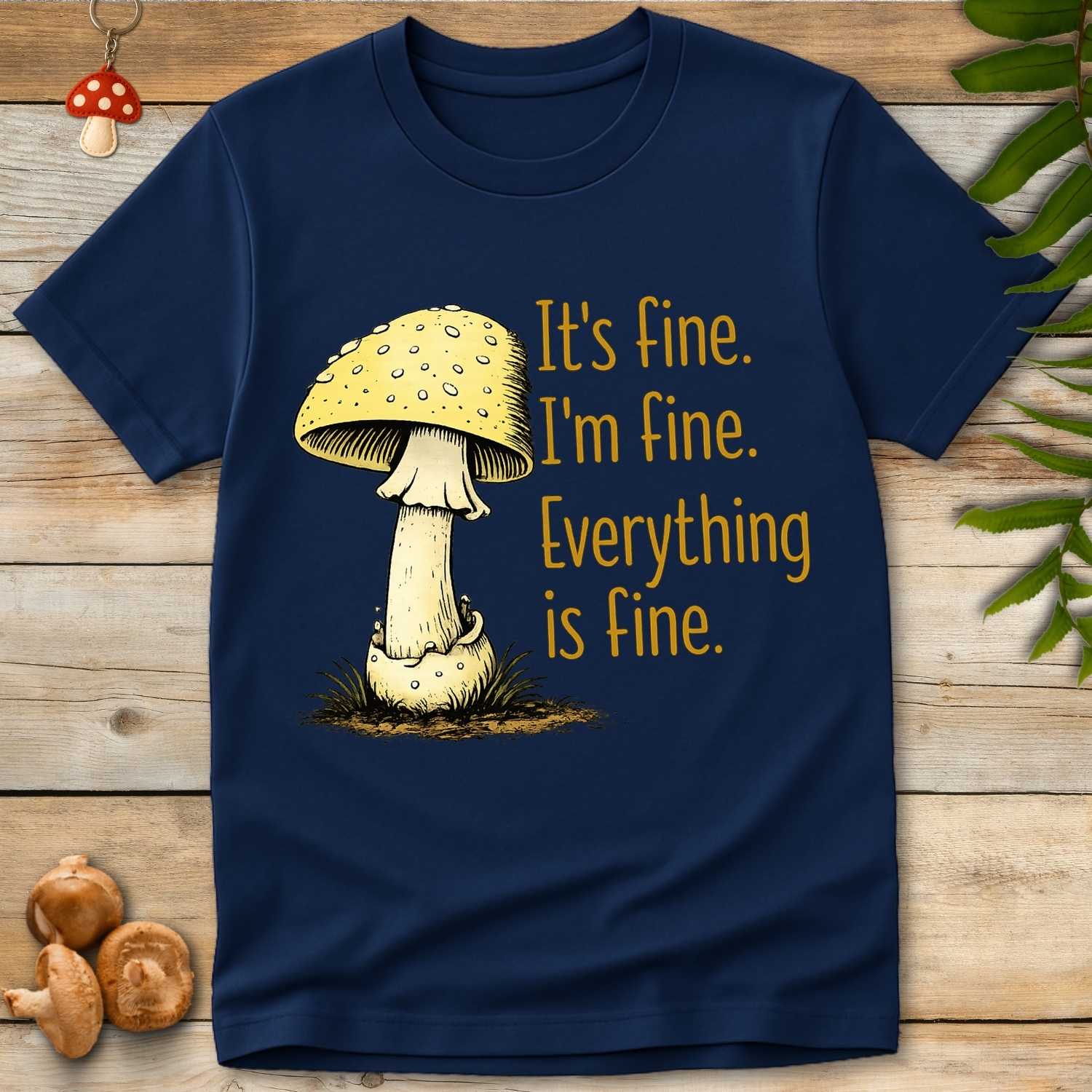 Yellow mushroom next to distressed text that reads “It’s fine. I’m fine. Everything is fine.” in orange font on navy background