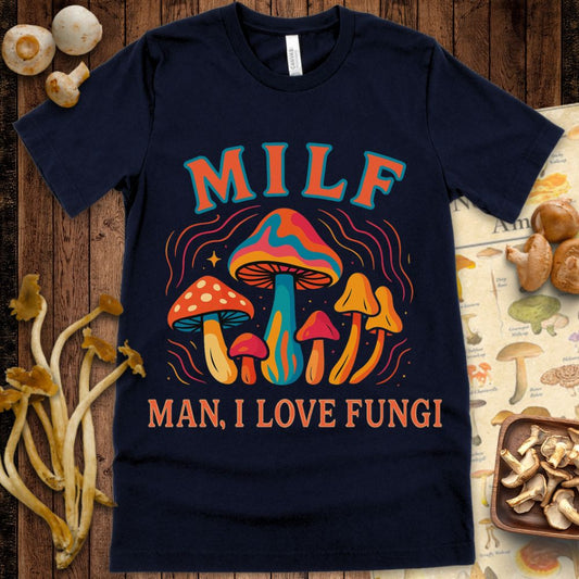 Bright and colorful cartoon-style T-shirt design with various mushrooms and the phrase "MILF – Man, I Love Fungi"