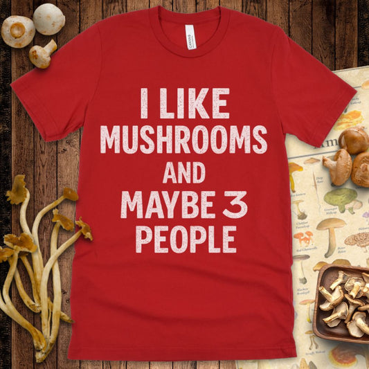 Black T-shirt design with bold white text that says “I like mushrooms and maybe 3 people”